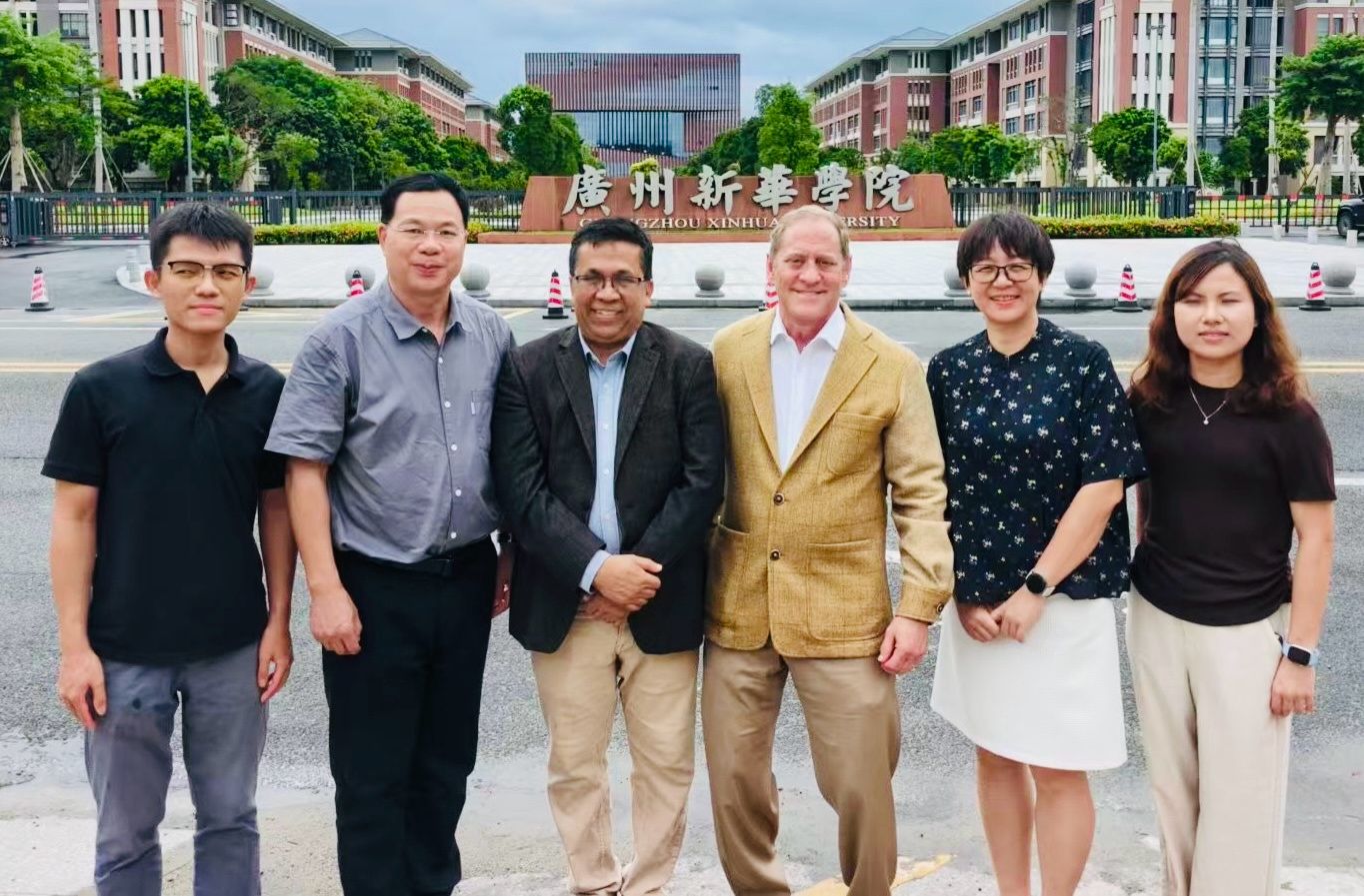 Dr. Mazhar Islam and Dr. Bobby Savoie pose with faculty and university leaders during their visit to Guangzhou Xinhua University in China.